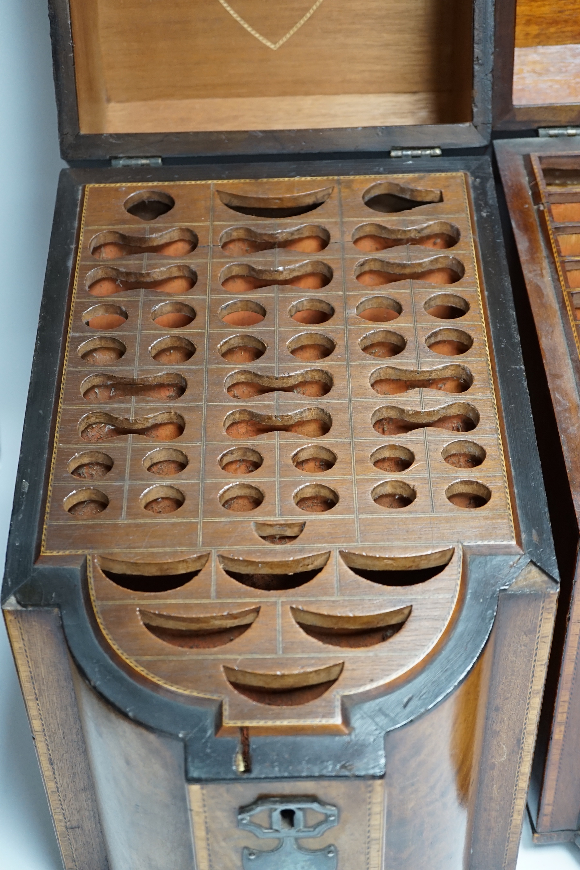 A pair of George III mahogany inlaid knife boxes with shield shaped lock plates (one converted), 38cm high